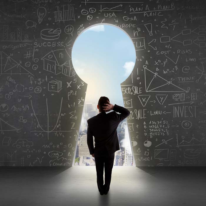 Man standing in front of key shaped doorway with data written on wall