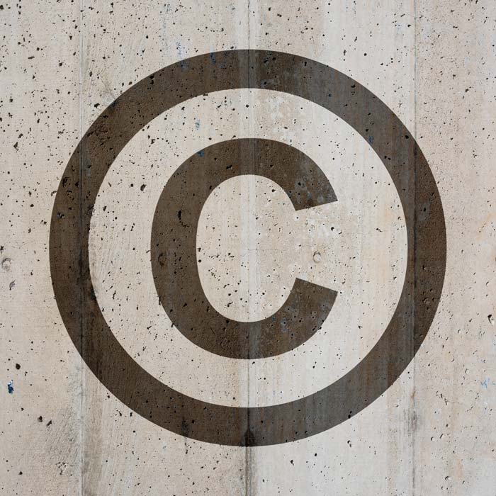 Copyright symbol on distressed background