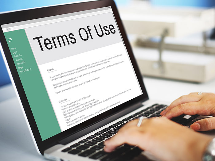 Person viewing terms of use on laptop